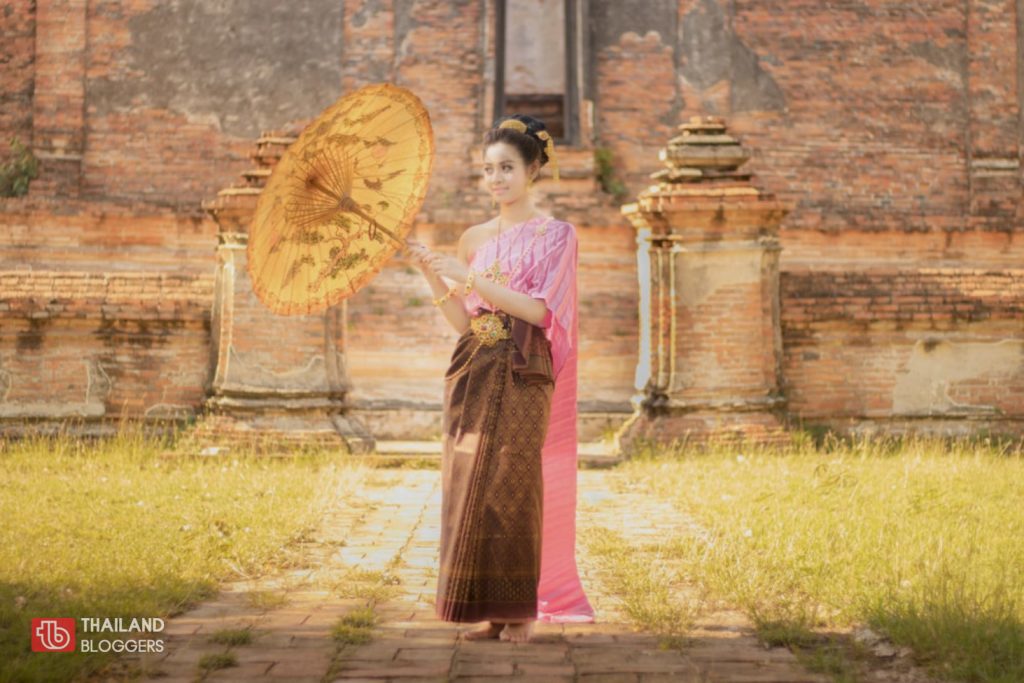 Asian woman wearing traditional Thai dress
